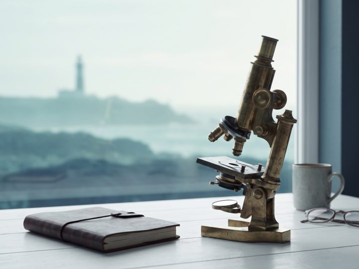 Microscope and lab notebook for diagnostic lab work